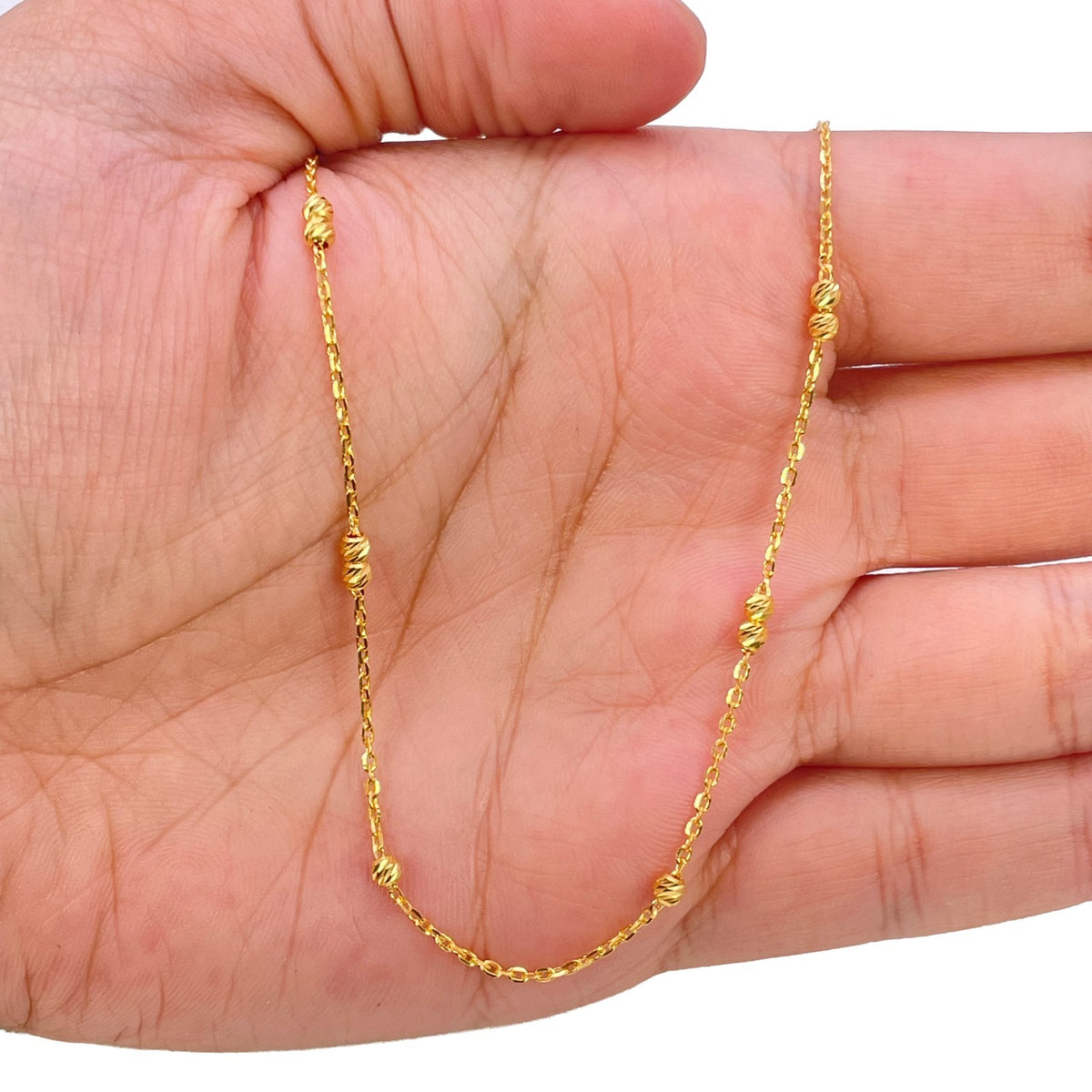 Spring ring clasp on 22ct yellow gold beaded cable chain necklace